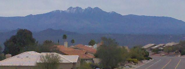 Arizona real estate view of the snow capped Four Peaks mountains east of Fountain Hills, AZ in mid-January